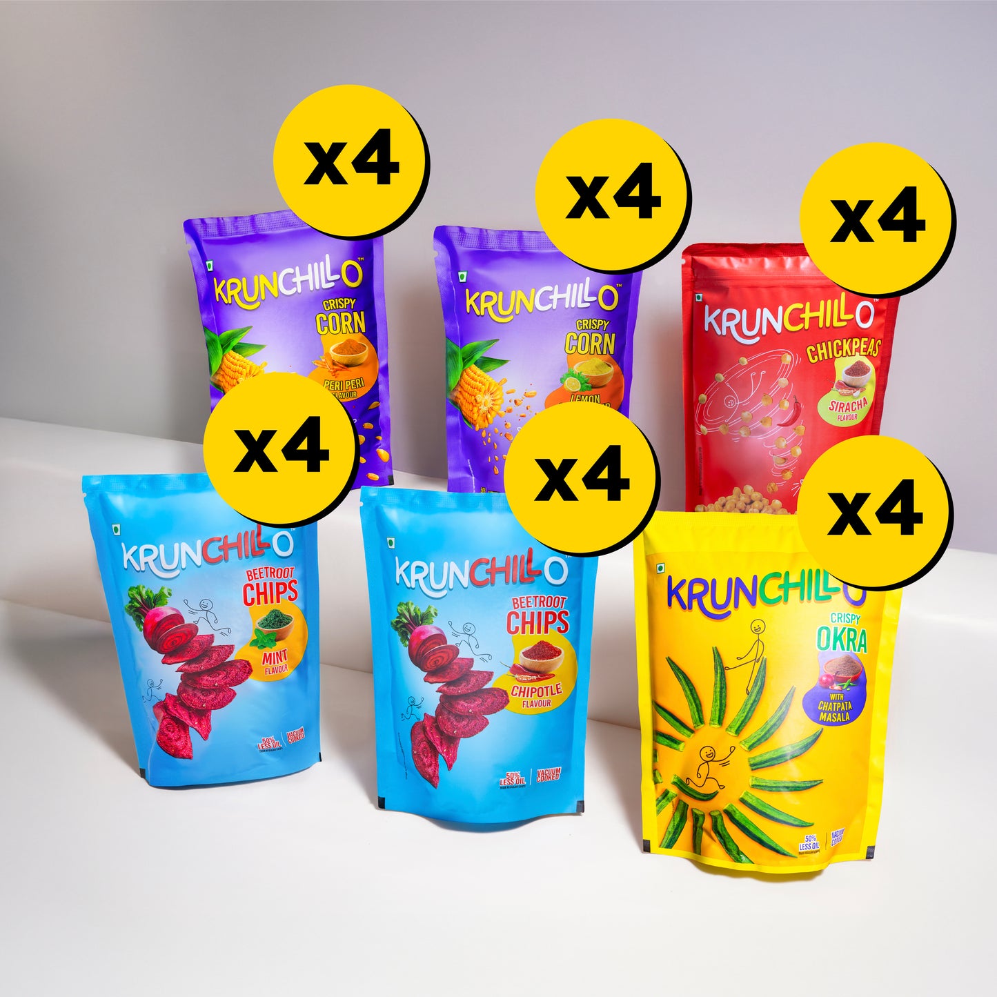 Assorted packages of Krunchillo snacks with colorful packaging on a white background
