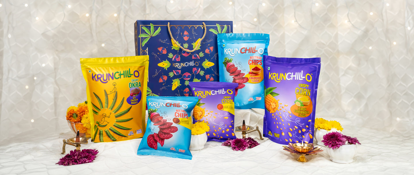 Colorful Krunchillo snack packages on a decorative background with lights