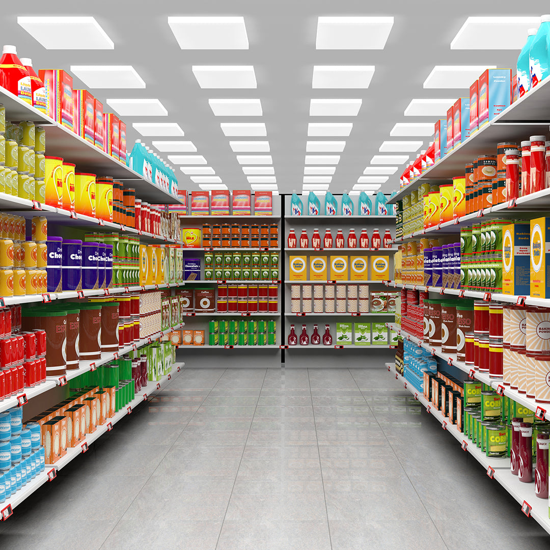Supermarket aisle with shelves stocked with various products.